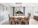 Elegant dining room with a large table, stylish chairs, and modern lighting at 3540 Pecos St, Denver, CO 80211