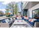 Inviting front porch with comfortable seating around a stone fire pit at 3540 Pecos St, Denver, CO 80211