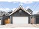 Detached garage with a modern exterior and white garage door at 3540 Pecos St, Denver, CO 80211
