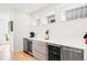 Kitchen bar area with built-in wine coolers and sleek countertops at 3540 Pecos St, Denver, CO 80211