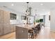 Open-concept kitchen with a large island, cooktop, pendant lights and seating at 3540 Pecos St, Denver, CO 80211