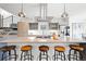 Kitchen island featuring a cooktop, barstool seating, and pendant lighting at 3540 Pecos St, Denver, CO 80211