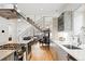 Modern kitchen featuring stainless steel appliances, sleek cabinets, and an open layout leading to the living area at 3540 Pecos St, Denver, CO 80211