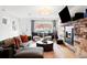 Inviting living room with rustic wood accent wall, fireplace, and modern furnishings at 3540 Pecos St, Denver, CO 80211