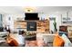 Bright living room with modern fireplace, stylish furniture, and warm lighting at 3540 Pecos St, Denver, CO 80211