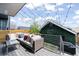 Outdoor patio featuring comfortable seating, string lights, and a green accent wall at 3540 Pecos St, Denver, CO 80211
