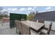 Rooftop deck with dining table and seating area at 3540 Pecos St, Denver, CO 80211
