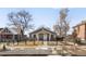 Charming single-story home with a well-maintained front yard and fenced front yard at 3251 N Madison St, Denver, CO 80205