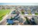 Modern community with homes near a vast green space and featuring backyard patios and solar panels at 16188 Elizabeth St, Thornton, CO 80602