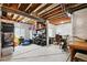 Unfinished basement with exposed ceiling beams, storage shelving and plenty of room to customize at 16188 Elizabeth St, Thornton, CO 80602