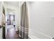Bathroom view from tub featuring tile floor, shower with curtain, and bedroom beyond at 16188 Elizabeth St, Thornton, CO 80602