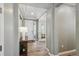 Light and bright foyer with hardwood floors and access to the office at 16188 Elizabeth St, Thornton, CO 80602