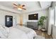 Spacious primary bedroom features a ceiling fan and recessed lights, and a gray dresser at 16188 Elizabeth St, Thornton, CO 80602
