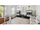 Well-lit office with french doors, storage and a neutral color palette at 16188 Elizabeth St, Thornton, CO 80602