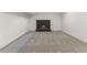 Finished basement showcasing a cozy fireplace with dark brick surround at 4580 Garland St, Wheat Ridge, CO 80033