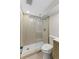Modern bathroom featuring glass shower with neutral tiling and contemporary fixtures at 4580 Garland St, Wheat Ridge, CO 80033