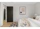 Comfortable bedroom with a view of the door, abstract art, and neutral tones at 4580 Garland St, Wheat Ridge, CO 80033