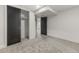 An empty bedroom features a closet, carpet, and door with white trim at 4580 Garland St, Wheat Ridge, CO 80033