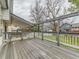 Backyard deck with a grey wood railing and steps to the yard at 11851 Elm Dr, Thornton, CO 80233