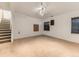 Spacious carpeted basement with multiple windows providing natural light at 11851 Elm Dr, Thornton, CO 80233