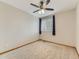 Neutral bedroom featuring a ceiling fan, window, and carpeted flooring at 11851 Elm Dr, Thornton, CO 80233