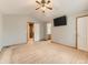 Bedroom featuring carpet, a ceiling fan, neutral paint, and natural wood trim at 11851 Elm Dr, Thornton, CO 80233