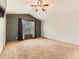 Spacious bedroom featuring vaulted ceilings, carpet, a ceiling fan, and neutral paint at 11851 Elm Dr, Thornton, CO 80233