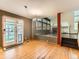 Dining room featuring hardwood floors and stairs to the living room at 11851 Elm Dr, Thornton, CO 80233