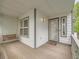 Cozy covered front porch with a porch swing, perfect for relaxing outdoors at 11851 Elm Dr, Thornton, CO 80233
