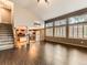 Bright living room featuring vaulted ceilings, hardwood floors, and large windows at 11851 Elm Dr, Thornton, CO 80233