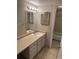 Bathroom featuring a vanity with a sink, mirror, and vanity lighting at 14751 E Tennessee Dr # 222, Aurora, CO 80012