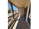Outdoor private deck space with view of nearby neighborhood parking area at 14751 E Tennessee Dr # 222, Aurora, CO 80012