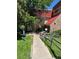 Property exterior with a walkway leading to the entrance and lush green grass at 14751 E Tennessee Dr # 222, Aurora, CO 80012