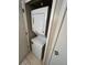 A laundry closet showing a stacked washer and dryer unit at 14751 E Tennessee Dr # 222, Aurora, CO 80012