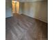 Neutral living room featuring brown carpet and doorways to adjoining spaces at 14751 E Tennessee Dr # 222, Aurora, CO 80012