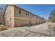 Exterior view of townhouse with garage and parking at 9957 Grove Way # F, Westminster, CO 80031