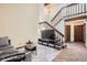 Spacious living area showcasing a staircase, vaulted ceilings, and wood-look floors, perfect for entertaining at 9957 Grove Way # F, Westminster, CO 80031