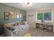 Inviting bedroom with a cozy bed, decorative accents, and natural light streaming through the window at 1750 E Noble Pl, Centennial, CO 80121