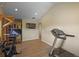 Spacious home gym featuring exercise equipment and a treadmill, promoting a healthy and active lifestyle at 1750 E Noble Pl, Centennial, CO 80121