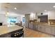 Bright kitchen with granite countertops, stainless steel appliances, and a breakfast nook for casual dining at 1750 E Noble Pl, Centennial, CO 80121