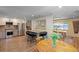 Spacious kitchen and dining area with granite countertops, stainless appliances, and an open layout for entertaining at 1750 E Noble Pl, Centennial, CO 80121