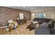 Cozy living room featuring modern decor, a comfortable sectional sofa, and ample natural light from a window at 1750 E Noble Pl, Centennial, CO 80121
