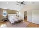 Bright main bedroom with vaulted ceiling, hardwood floors, and a walk-in closet access at 1750 E Noble Pl, Centennial, CO 80121