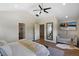 Comfortable main bedroom with hardwood floors, a sofa, and an en-suite bathroom at 1750 E Noble Pl, Centennial, CO 80121