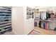Organized walk-in closet with ample storage for shoes, clothes, and accessories at 1750 E Noble Pl, Centennial, CO 80121