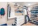 Spacious walk-in closet with multiple shelves, drawers, and hanging racks for optimal organization at 1750 E Noble Pl, Centennial, CO 80121