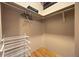 Spacious walk-in closet with custom shelving and hanging rods offers ample storage space at 1800 Lawrence St # 303, Denver, CO 80202