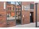 Front exterior of the building with brick facade at 1800 Lawrence St # 303, Denver, CO 80202