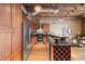 Modern kitchen with stainless steel appliances, granite countertops, and ample cabinet space at 1800 Lawrence St # 303, Denver, CO 80202
