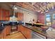Contemporary kitchen featuring granite countertops, stainless steel appliances, and wooden cabinets at 1800 Lawrence St # 303, Denver, CO 80202